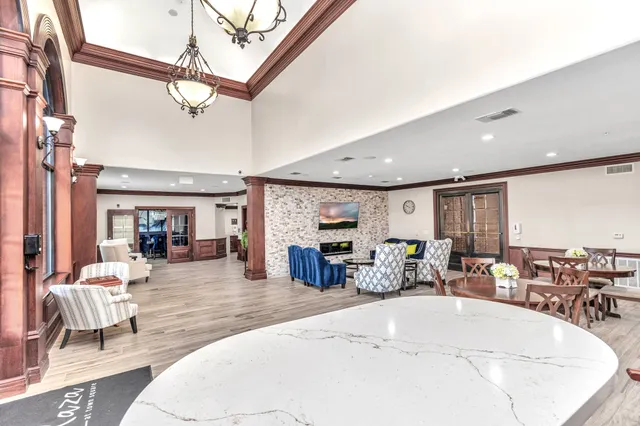 a view of a dining room with furniture window and outside view