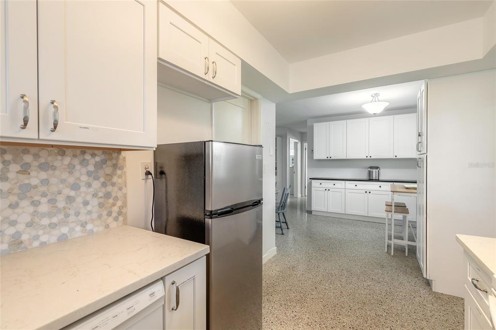 3948 Cardinal Boulevard Port Orange, FL 32127 - Photo 12 of 37 a kitchen with a refrigerator and a sink