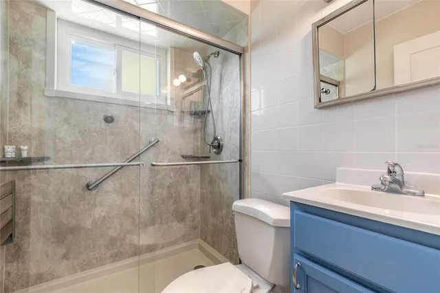 a bathroom with a sink a mirror and a toilet