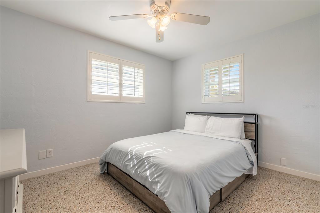 3948 Cardinal Boulevard Port Orange, FL 32127 - Photo 16 of 37 a bedroom with a bed and a window
