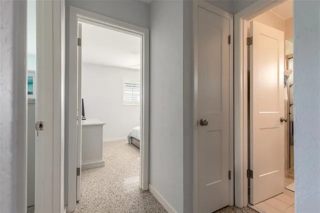 a view of a bathroom from the hallway with toilet