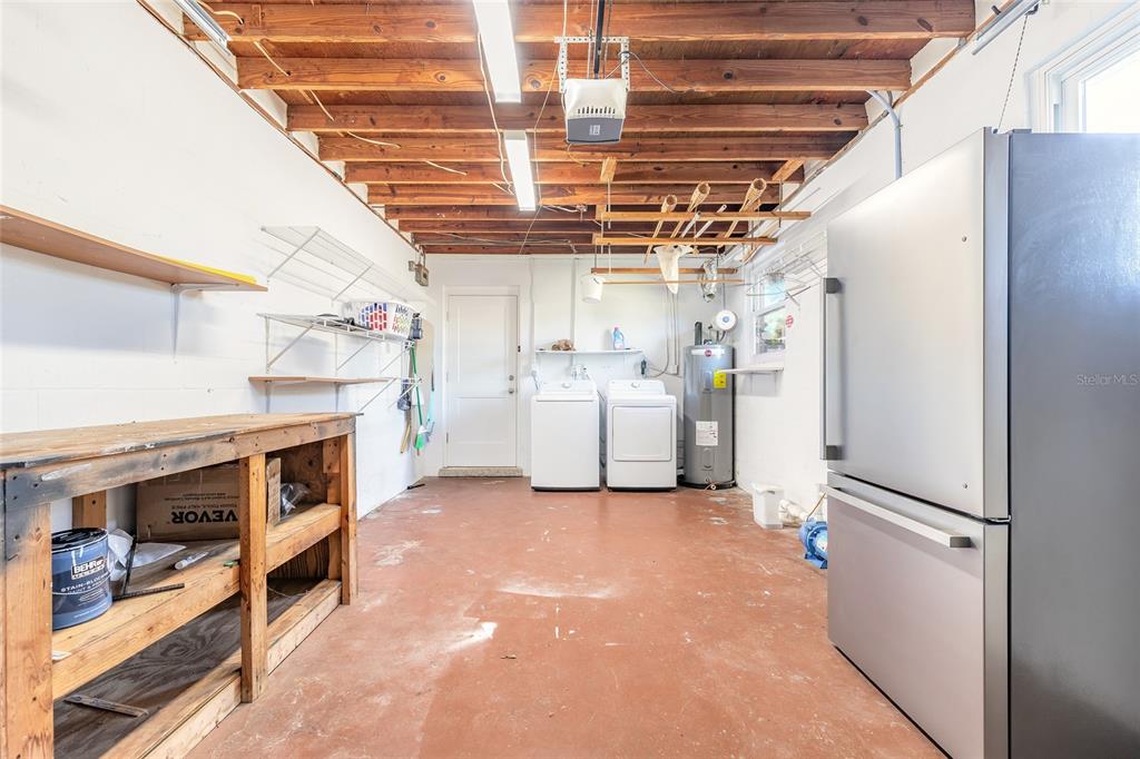 3948 Cardinal Boulevard Port Orange, FL 32127 - Photo 20 of 37 a utility room with dryer and washer