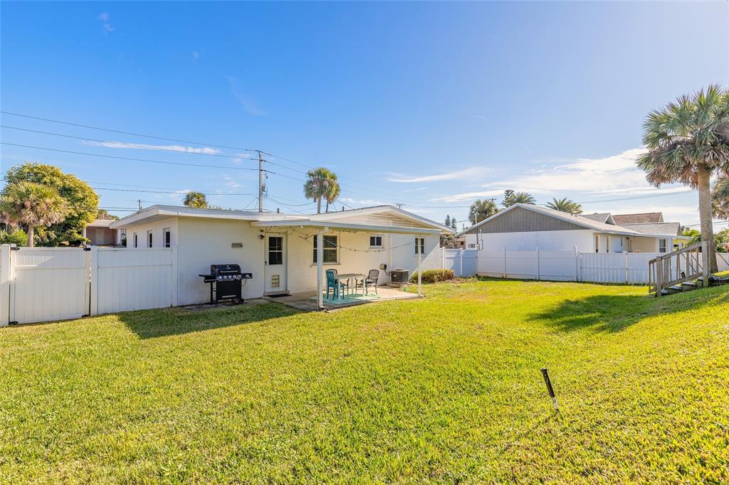 3948 Cardinal Boulevard Port Orange, FL 32127 - Photo 22 of 37 a view of a swimming pool with an outdoor seating