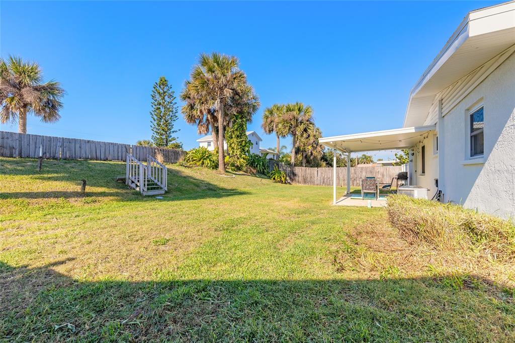 3948 Cardinal Boulevard Port Orange, FL 32127 - Photo 24 of 37 a view of a swimming pool with an outdoor space