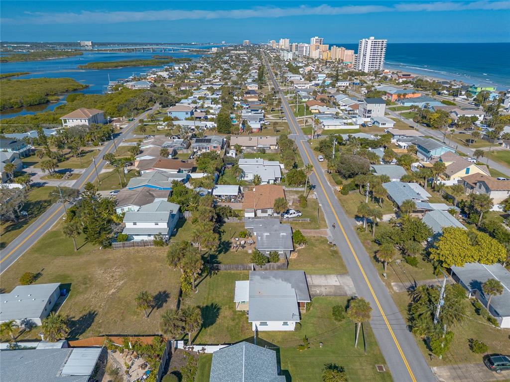 3948 Cardinal Boulevard Port Orange, FL 32127 - Photo 33 of 37 an aerial view of residential houses with outdoor space