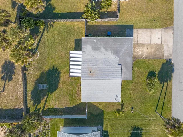 an aerial view of residential house with outdoor space