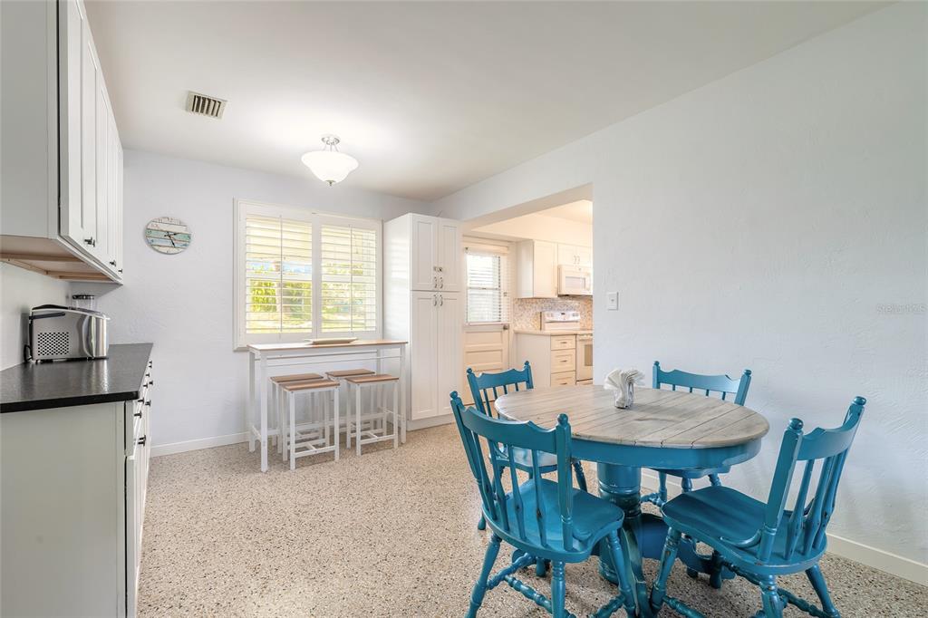 3948 Cardinal Boulevard Port Orange, FL 32127 - Photo 6 of 37 a view of a dining room with furniture and a window