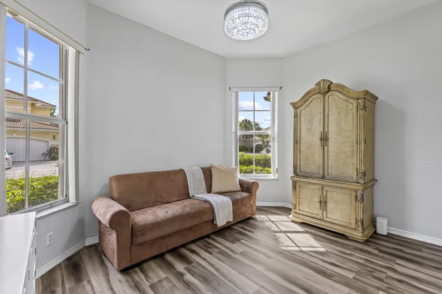 a bedroom with a bed and a mirror