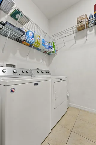 a lobby with furniture and a wooden floor