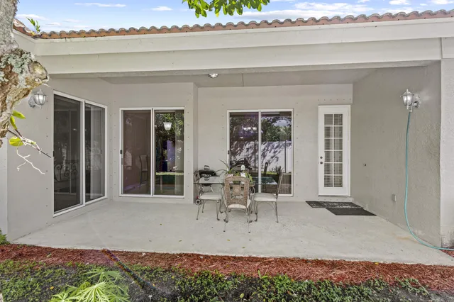 a large bed sitting in a bedroom next to a window