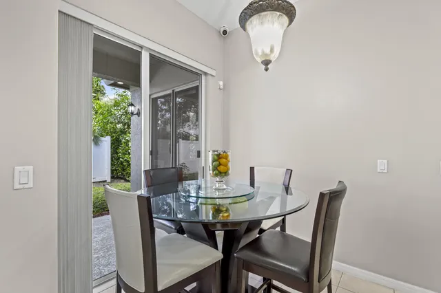 a white toilet sitting next to a white wall