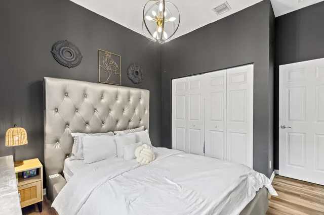 a view of a backyard with table and chairs and potted plants