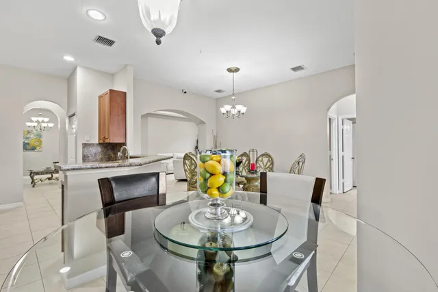 a bedroom with a bed chair and window