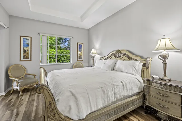 a bedroom with a bed and a table in it