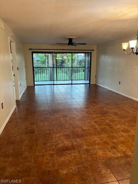 1220 Commonwealth Circle, Unit M206 Naples, FL 34116 - Photo 2 of 8 wooden floor in an empty room with a window