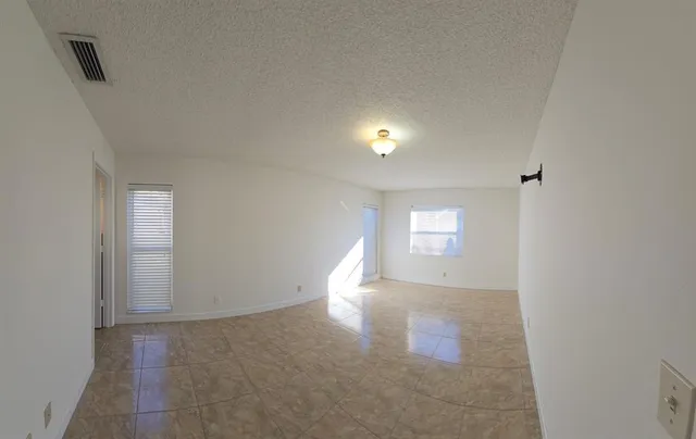a view of an empty room and window