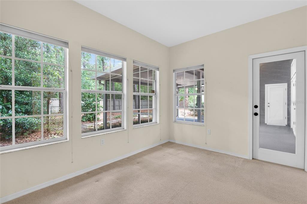 9626 Southwest 53rd Road Gainesville, FL 32608 - Photo 12 of 23 an empty room with windows