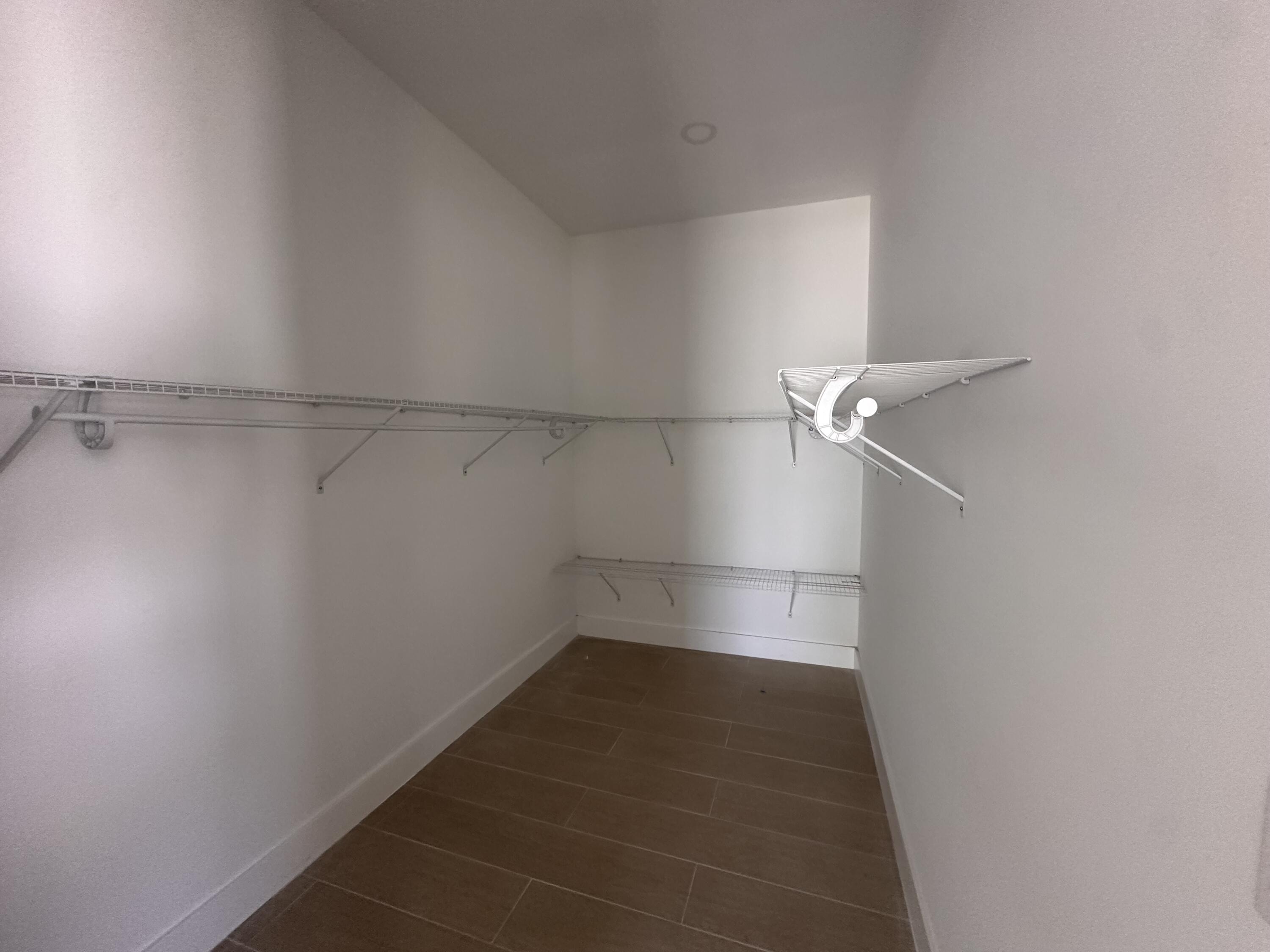 106 Northview Drive Jupiter, FL 33458 - Photo 6 of 13 a view of a room with racks on the wall