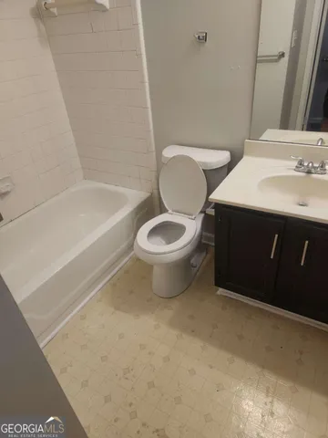 a bathroom with a toilet and a sink