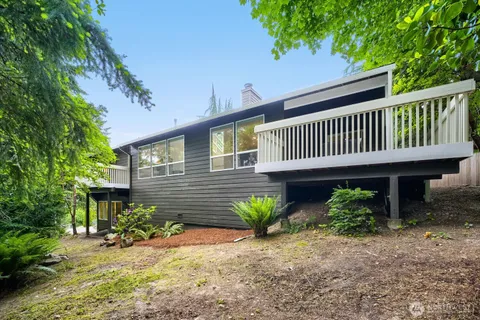 a view of a house with a flower garden
