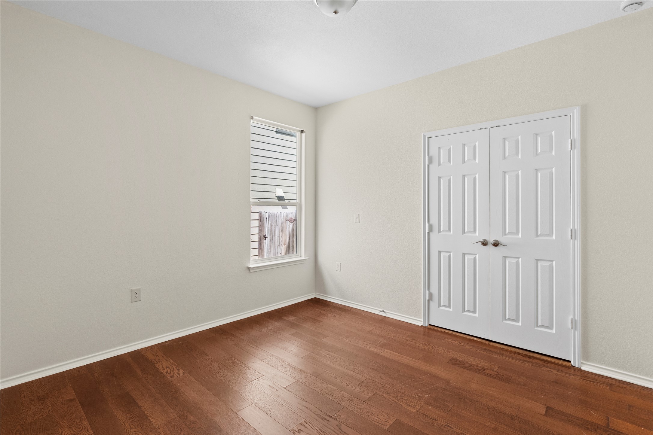 8613 Capitol View Drive Austin, TX 78747 - Photo 7 of 33 Rich hardwood flooring adds warmth to this versatile living space, perfect for an office or additional bedroom.