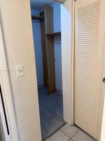 a bathroom with a sink vanity and mirror