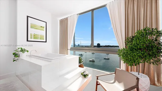 a dining room with a window and furniture