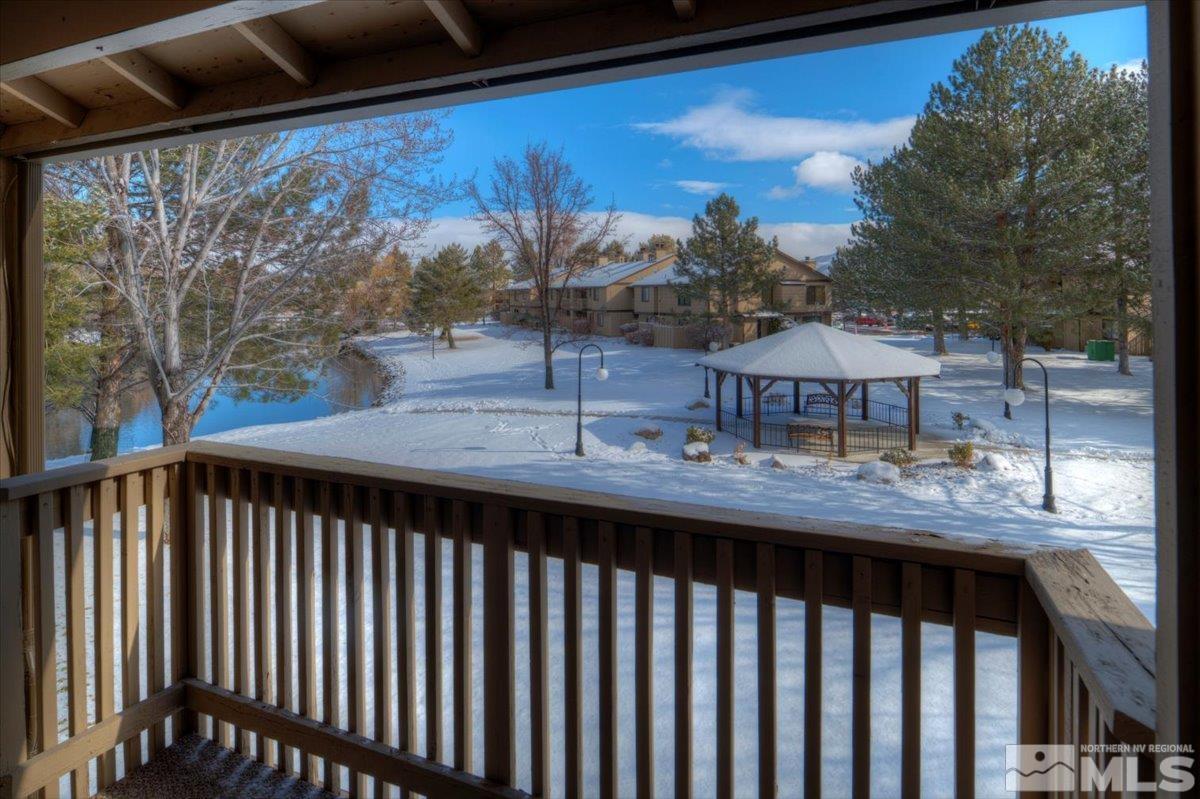 4658 Rio Poco Road Reno, NV 89502 - Photo 11 of 31 a view of a balcony with two chairs and a table