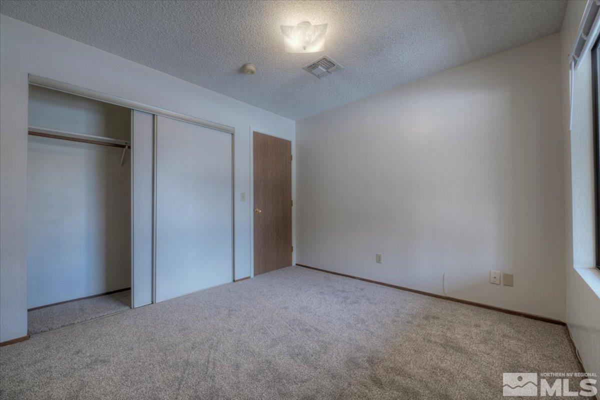 4658 Rio Poco Road Reno, NV 89502 - Photo 13 of 31 an empty room with closet area