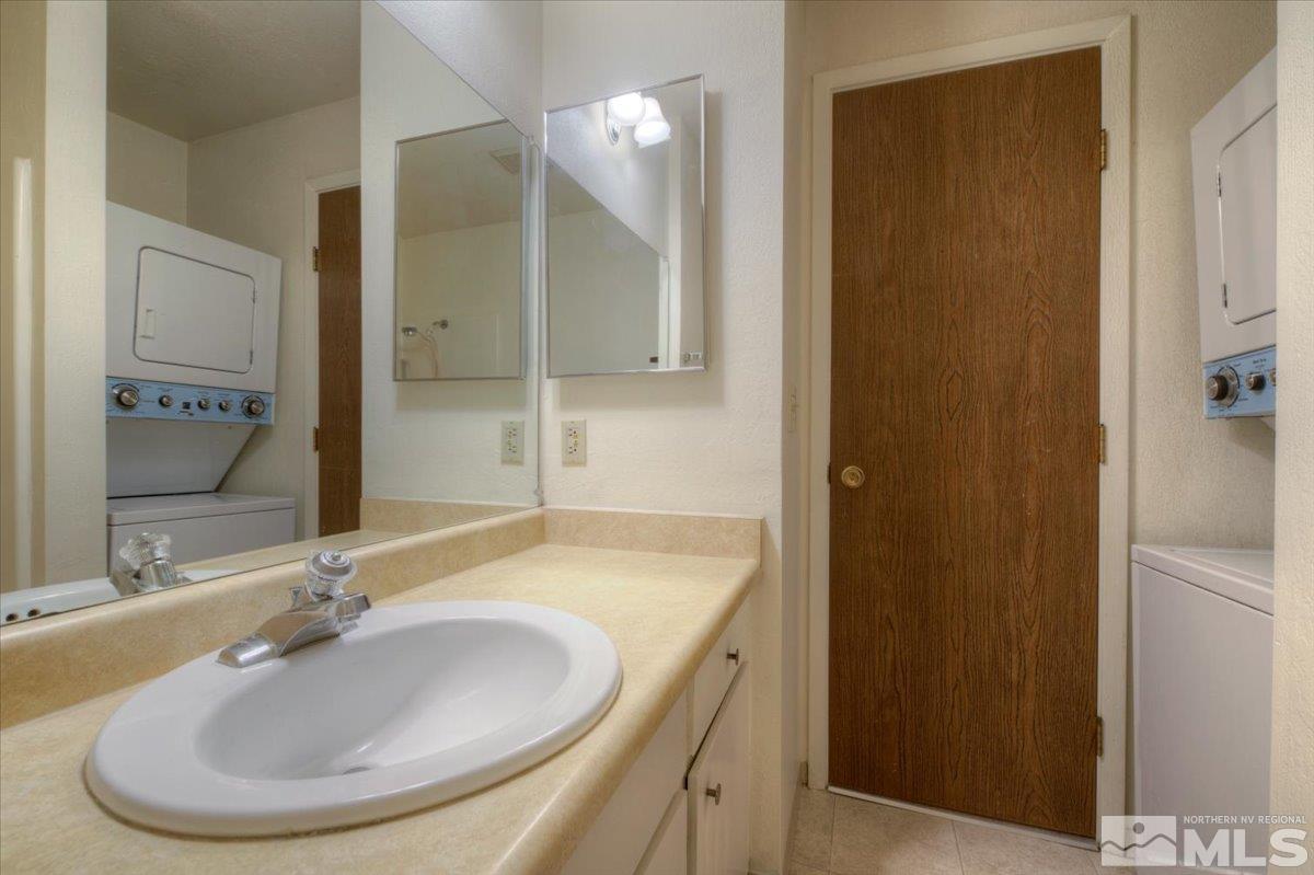 4658 Rio Poco Road Reno, NV 89502 - Photo 18 of 31 a bathroom with a sink and a mirror