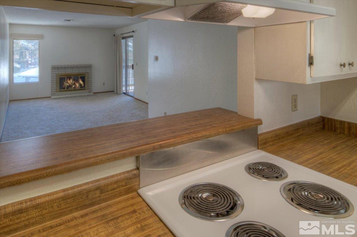 4658 Rio Poco Road Reno, NV 89502 - Photo 6 of 31 a kitchen with a stove and a refrigerator