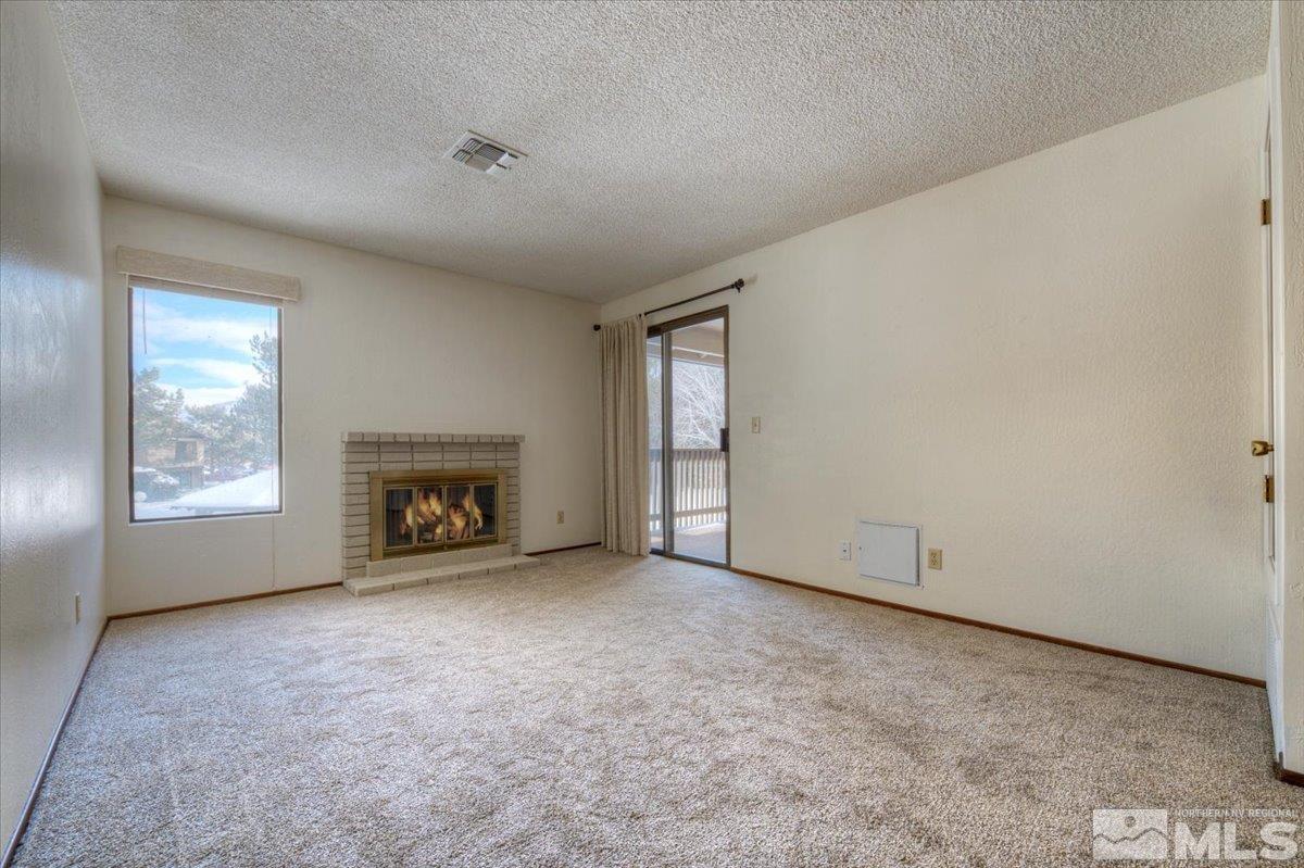 4658 Rio Poco Road Reno, NV 89502 - Photo 8 of 31 an empty room with windows