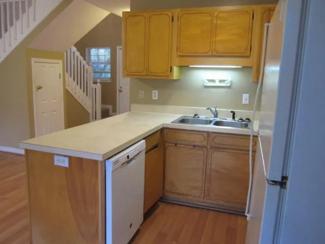 a utility room with a sink washer and dryer