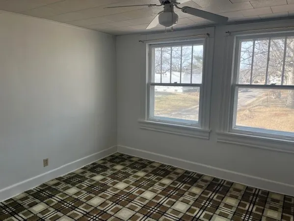 a view of an empty room and window