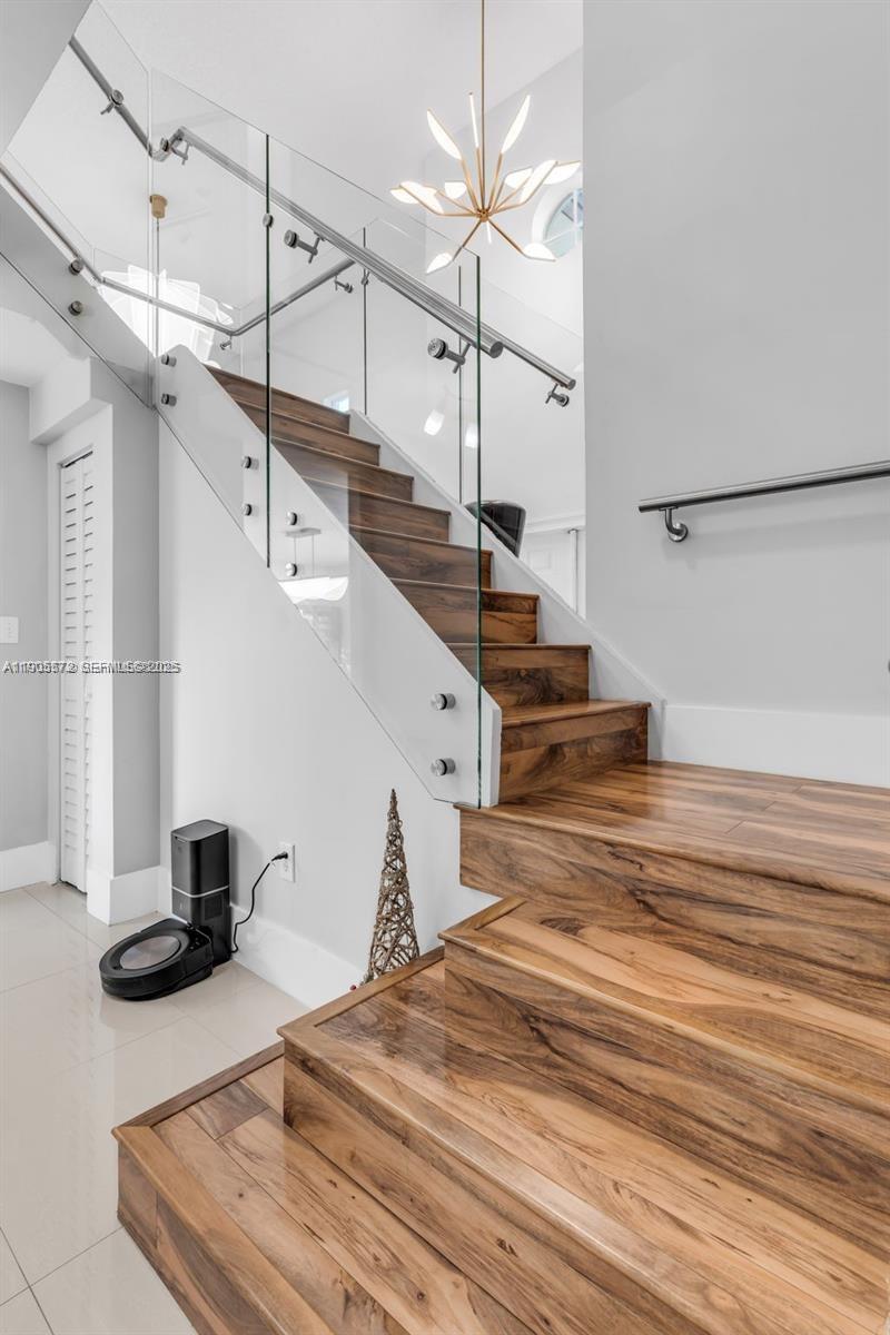 14206 Southwest 164th Terrace Miami, FL 33177 - Photo 19 of 58 a view of entryway and hall with wooden floor