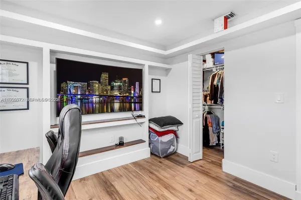 a bedroom with a bed and furniture