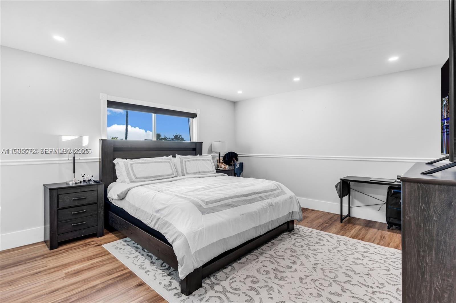 14206 Southwest 164th Terrace Miami, FL 33177 - Photo 27 of 58 a bed room with a bed and a chair