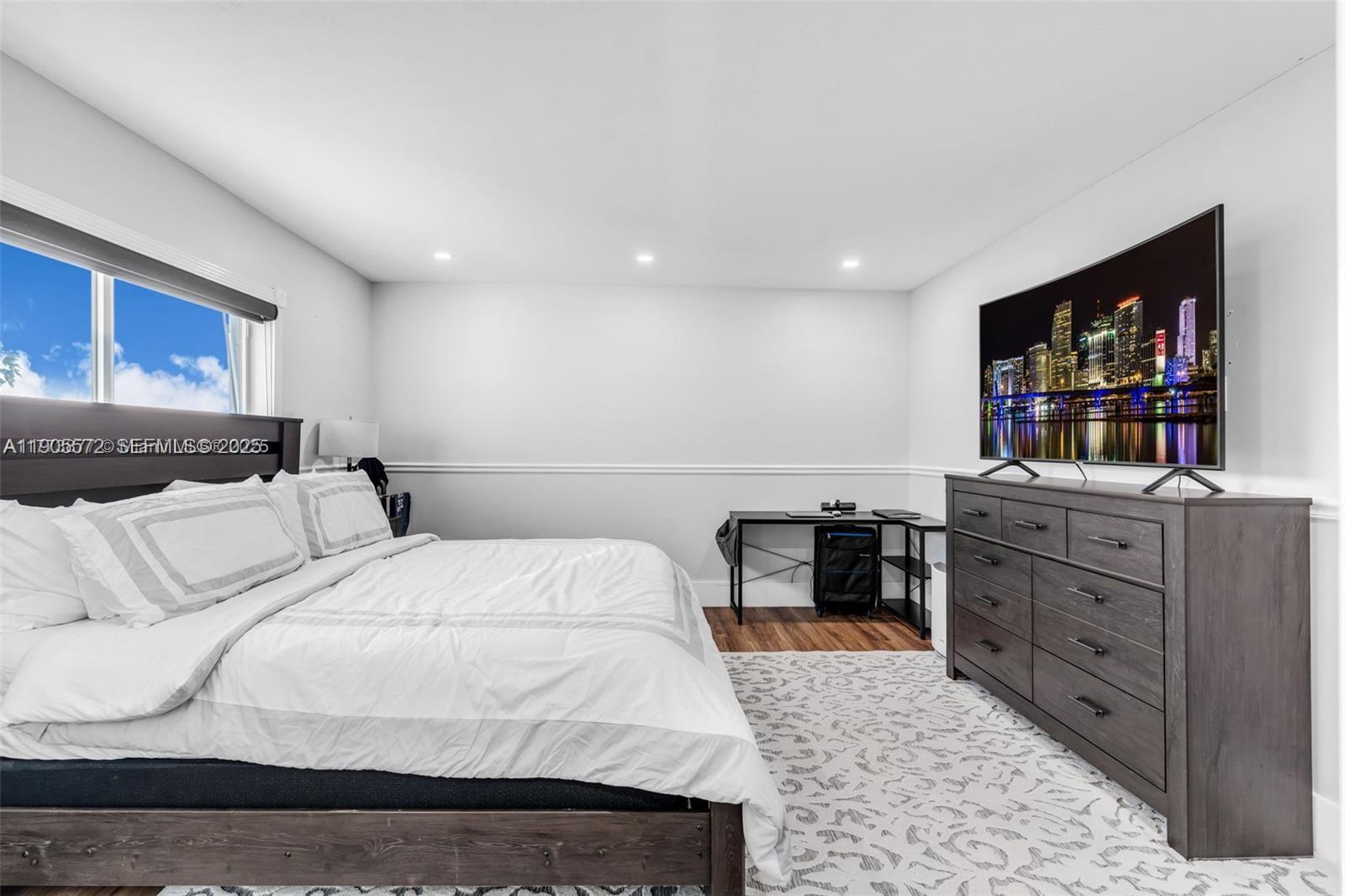 14206 Southwest 164th Terrace Miami, FL 33177 - Photo 29 of 58 a bedroom with a bed and furniture