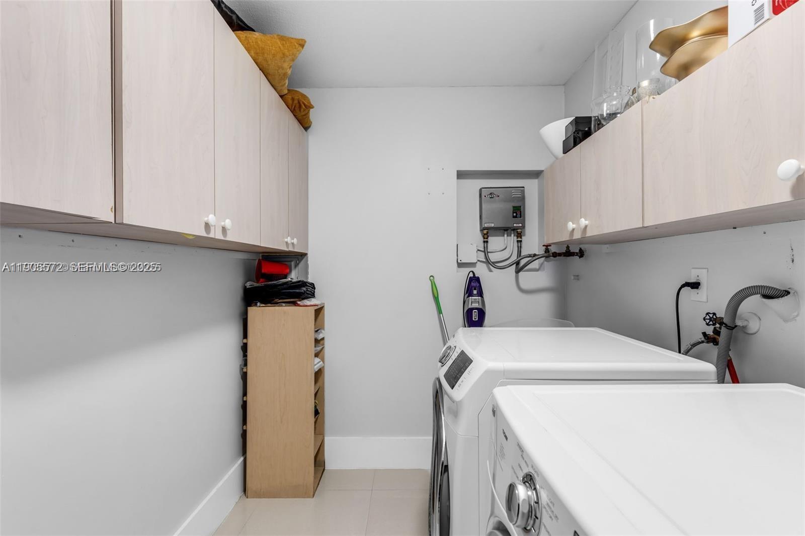 14206 Southwest 164th Terrace Miami, FL 33177 - Photo 37 of 58 a utility room with dryer and washer