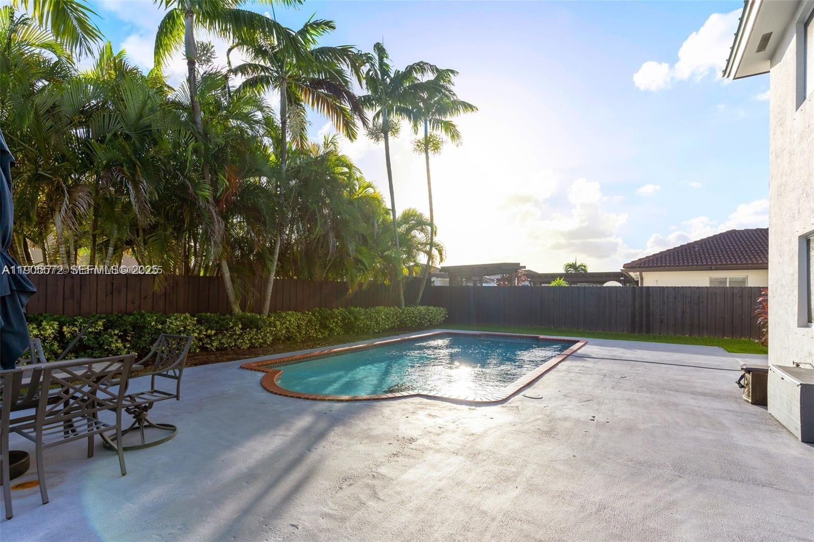 14206 Southwest 164th Terrace Miami, FL 33177 - Photo 40 of 58 a view of a backyard
