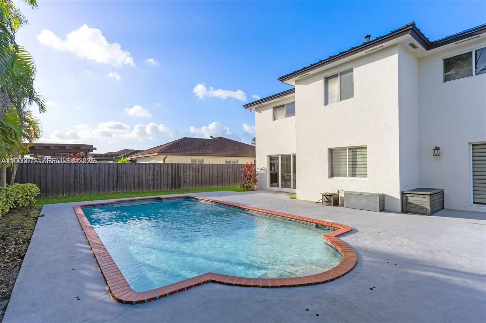 14206 Southwest 164th Terrace Miami, FL 33177 - Photo 41 of 58 an outdoor space with pool and furniture