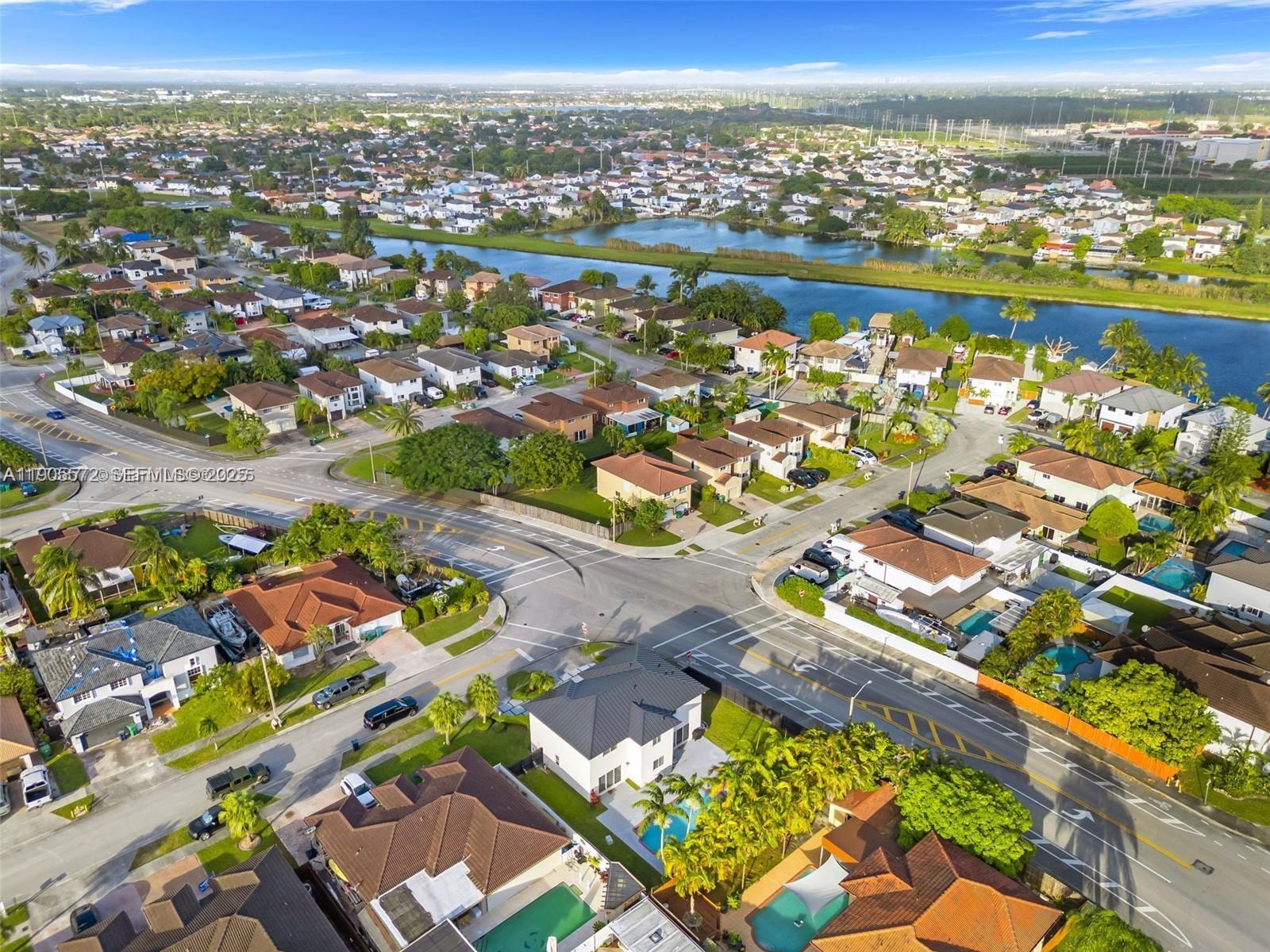 14206 Southwest 164th Terrace Miami, FL 33177 - Photo 52 of 58 an aerial view of residential houses with outdoor space