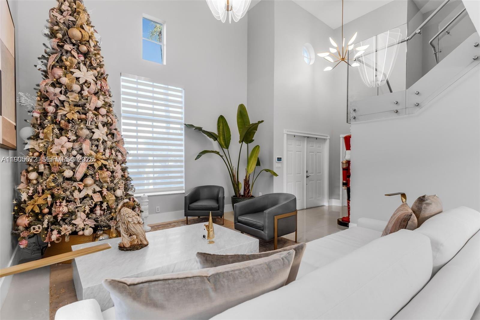 14206 Southwest 164th Terrace Miami, FL 33177 - Photo 10 of 58 a living room with furniture and a potted plant