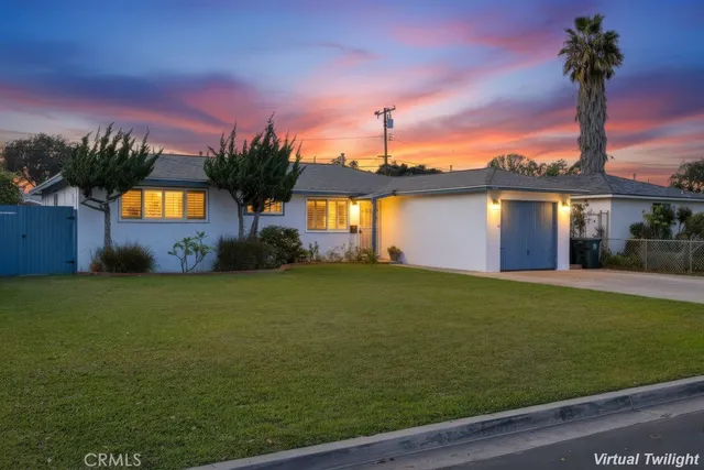 a view of a house with swimming pool yard and a yard