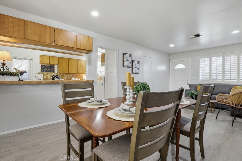 11681 Wasco Road Garden Grove, CA 92841 - Photo 13 of 58 a view of a dining room with furniture and wooden floor