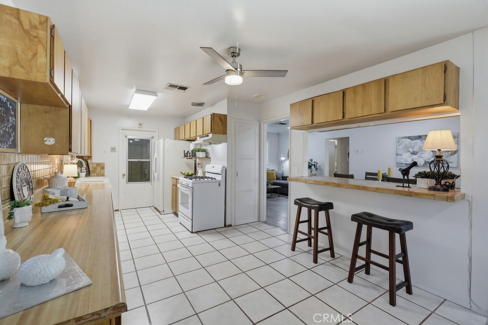 11681 Wasco Road Garden Grove, CA 92841 - Photo 19 of 58 a kitchen with a sink appliances and cabinets
