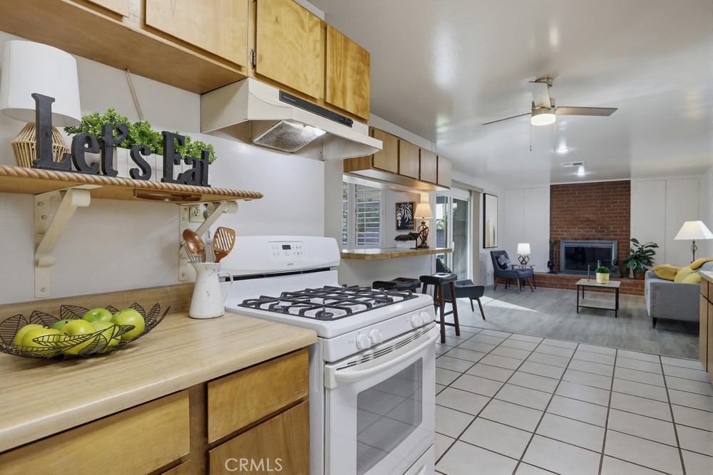 11681 Wasco Road Garden Grove, CA 92841 - Photo 22 of 58 a kitchen with stainless steel appliances kitchen island granite countertop a sink and cabinets