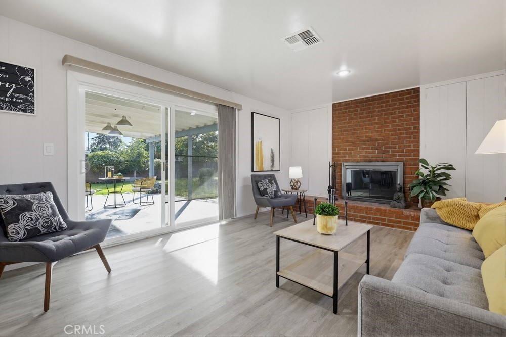 11681 Wasco Road Garden Grove, CA 92841 - Photo 26 of 58 a living room with furniture and a fireplace