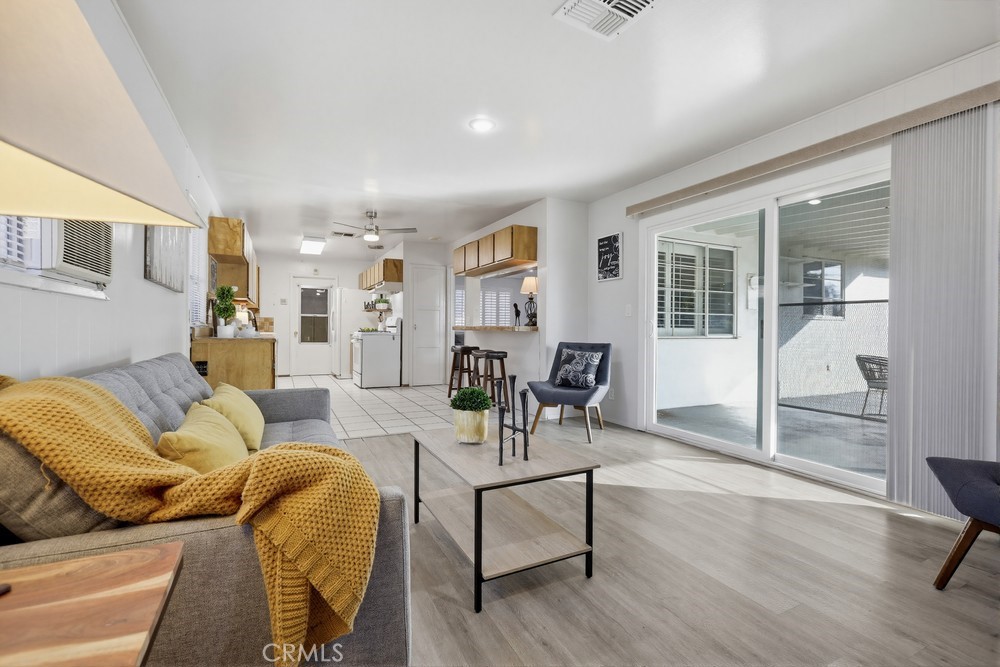 11681 Wasco Road Garden Grove, CA 92841 - Photo 27 of 58 a living room with furniture and a table