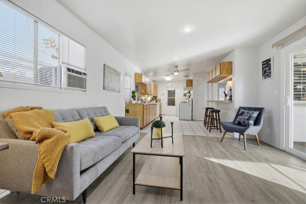 11681 Wasco Road Garden Grove, CA 92841 - Photo 28 of 58 a living room with furniture and a wooden floor
